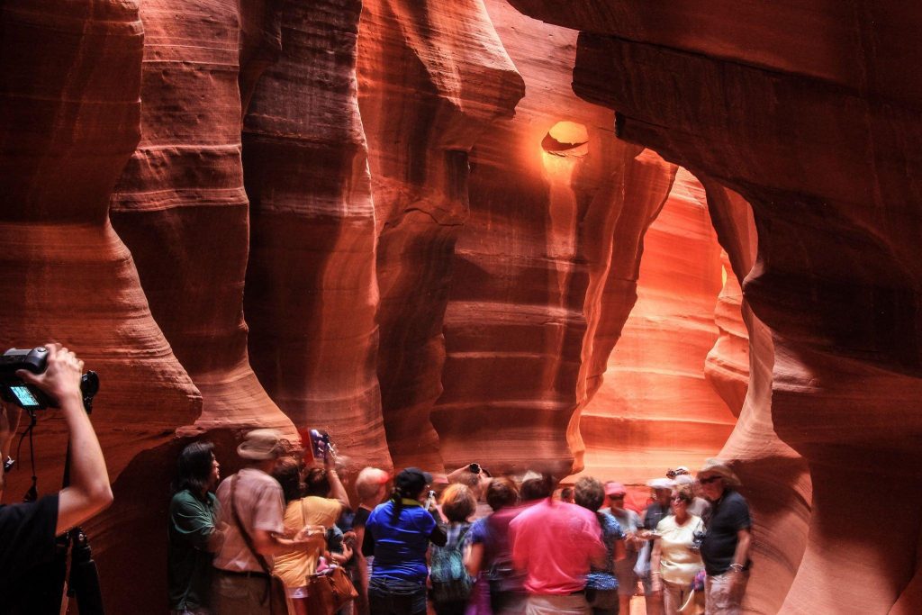 Tourists enjoying visit and photographing